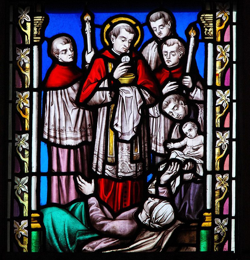 BRUSSELS, BELGIUM - MARCH 13, 2017: Stained Glass in the Church of Our Blessed Lady of the Sablon in Brussels, Belgium, depicting Saint Charles Borromeo or Carolus Borromeus